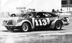 Dennis Burford races a Monaro